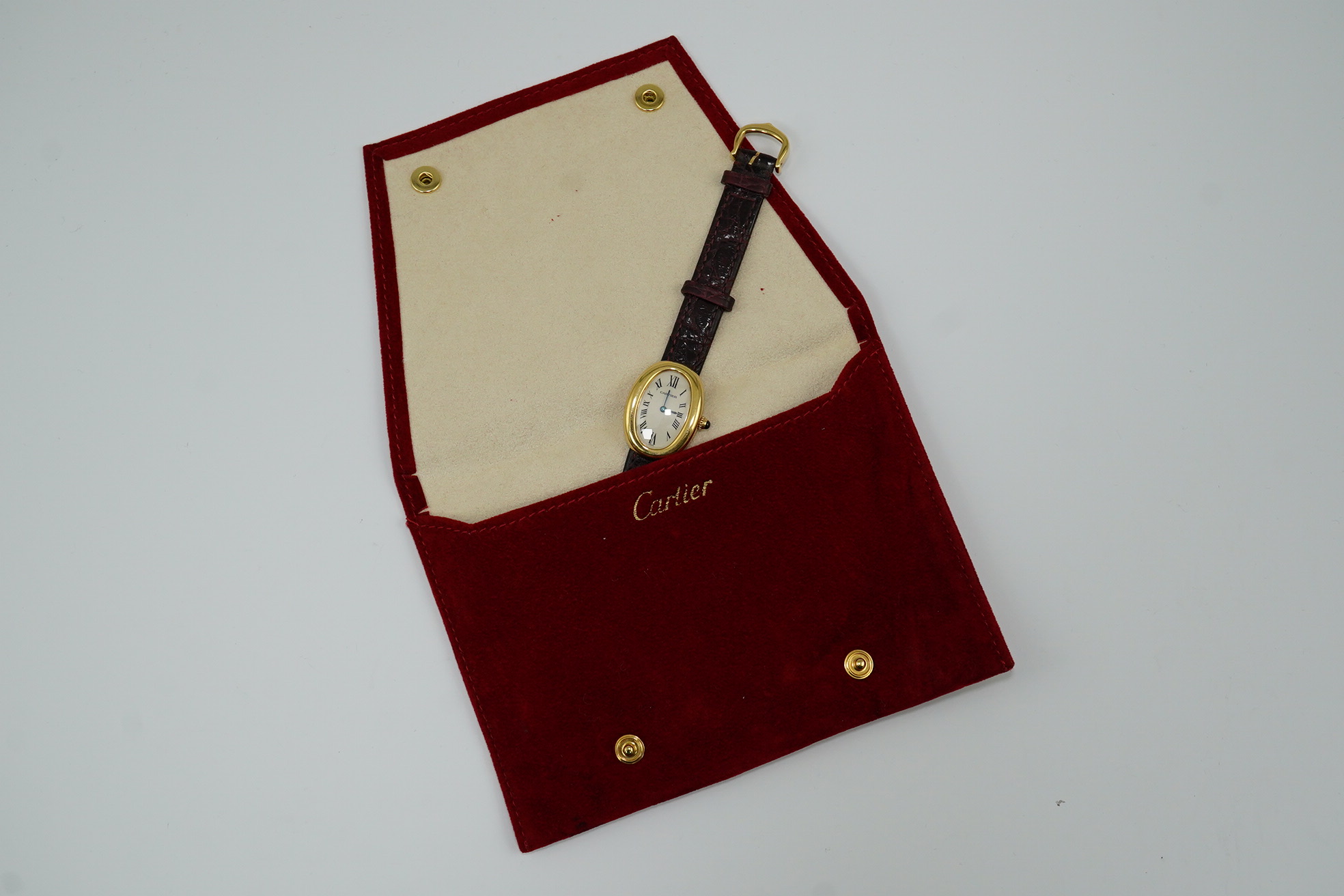 A lady's 2000 18ct gold Cartier Baignoire quartz wrist watch, on a Cartier leather strap